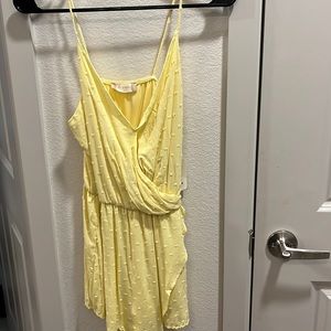 Size xs, yellow romper with dots, never worn